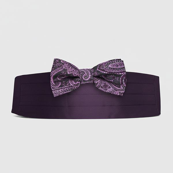 Eggplant paisley bow tie paired with a matching solid eggplant cummerbund styled as a coordinated formalwear set for a tuxedo look.