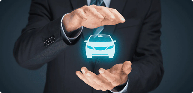 A person in a suit holding a holographic car.