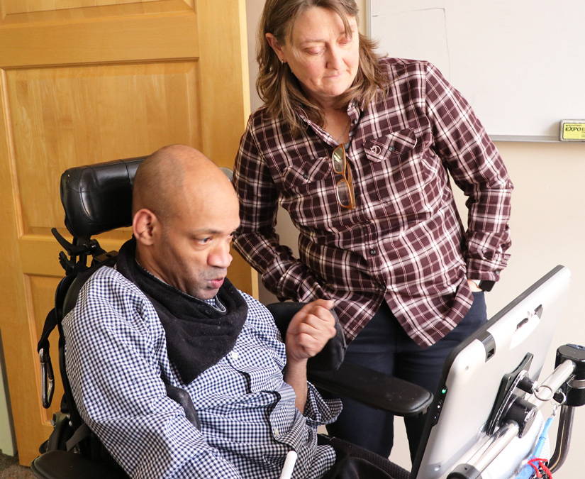  Man uses a Tobii Dynavox device with eye tracking to click and choose an object on the screen