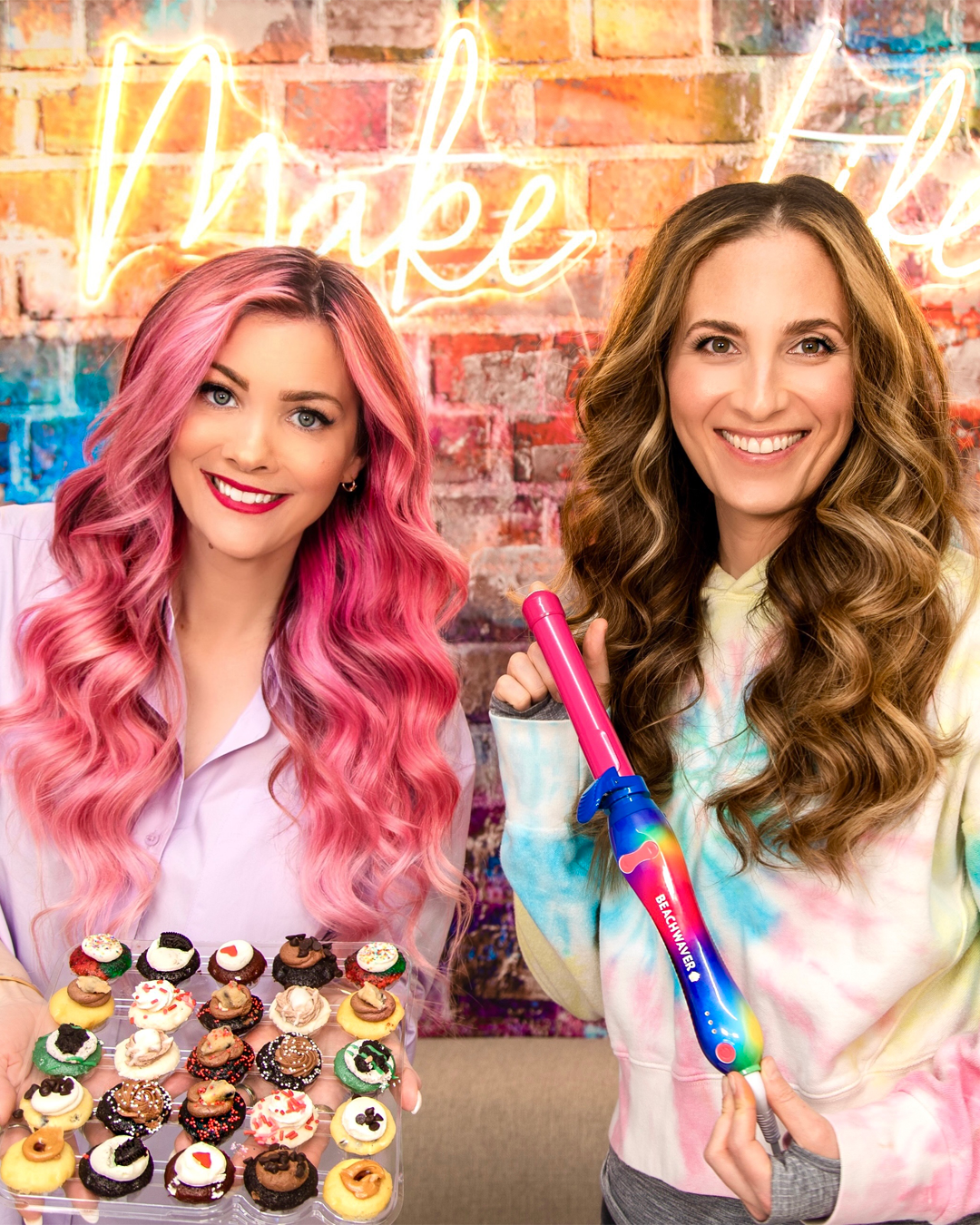 Image of Sarah Potempa and Baked by Melissa posing with a beach waver and cupcakes