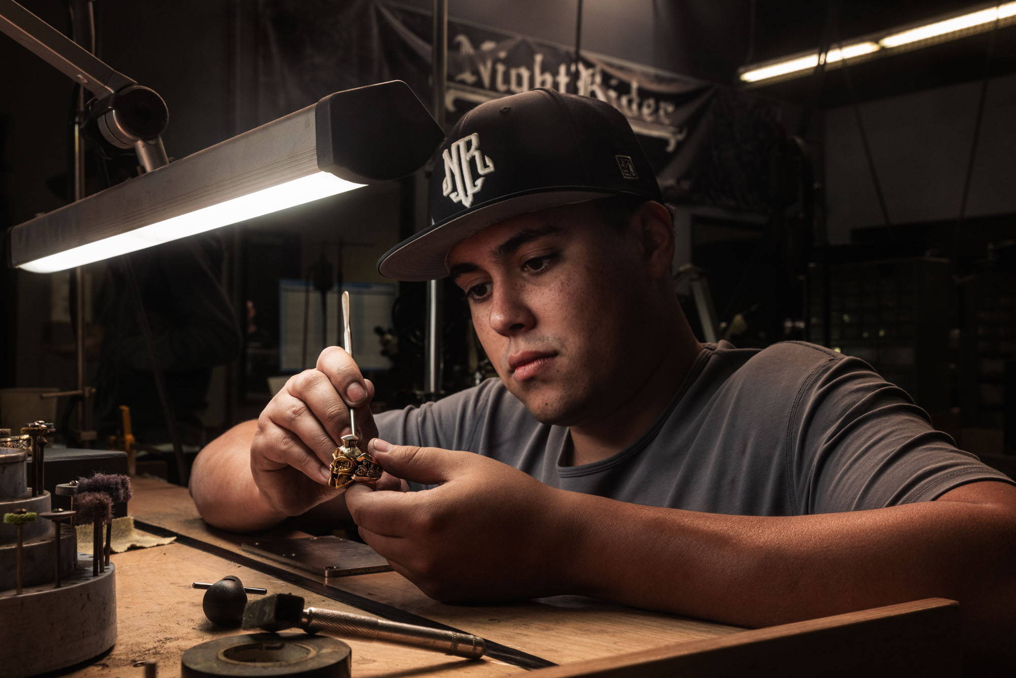 A jeweler handcrafts a NightRider Luxe ring