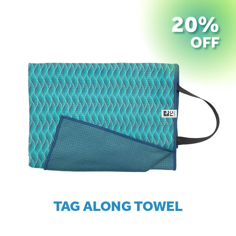 A blue textured towel with a handle, labeled 