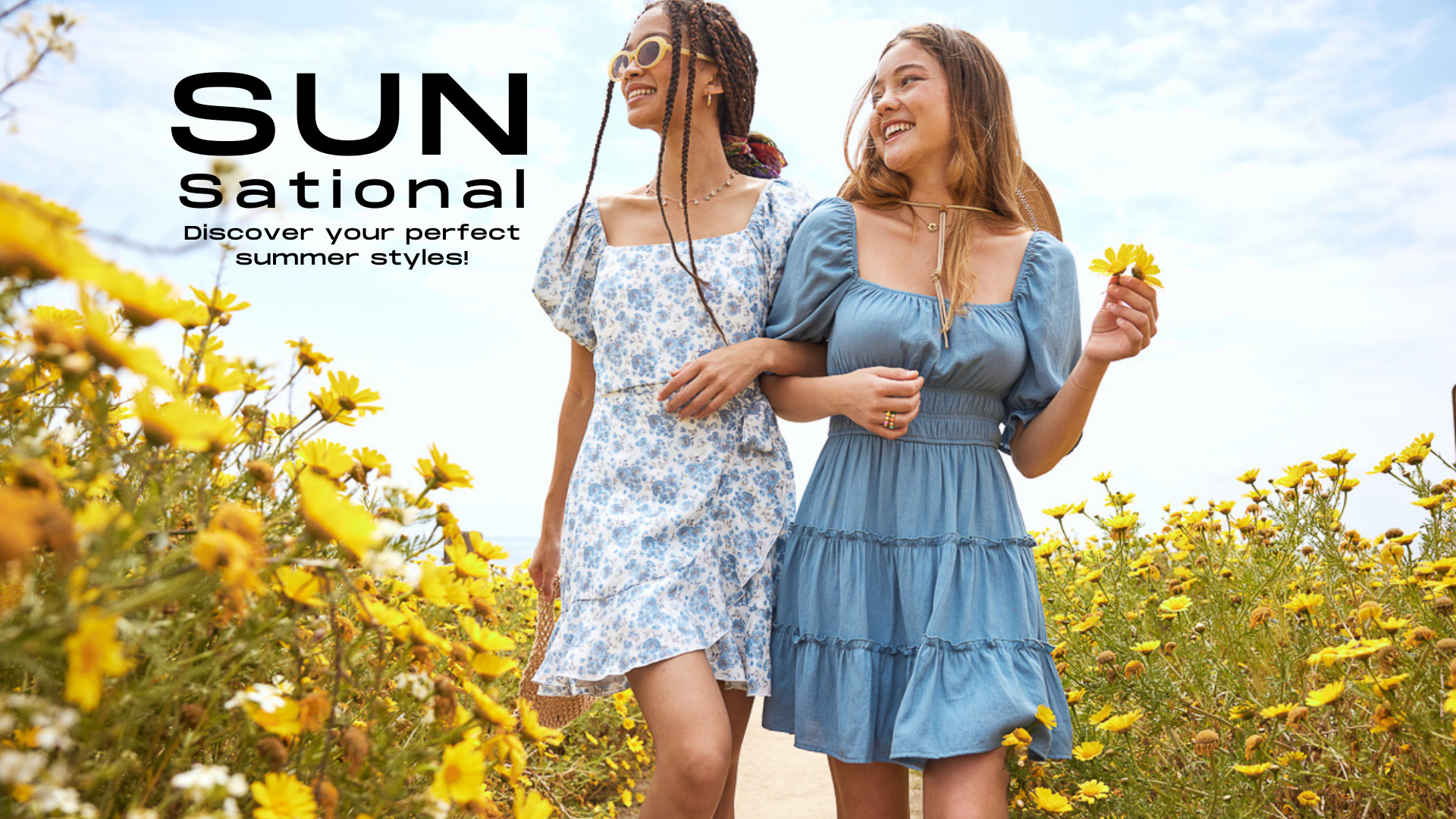 trixxi SUN-sational summer campaign with two girls walking in yellow flower field in a blue tier dress and a blue floral wrap ruffle dress.
