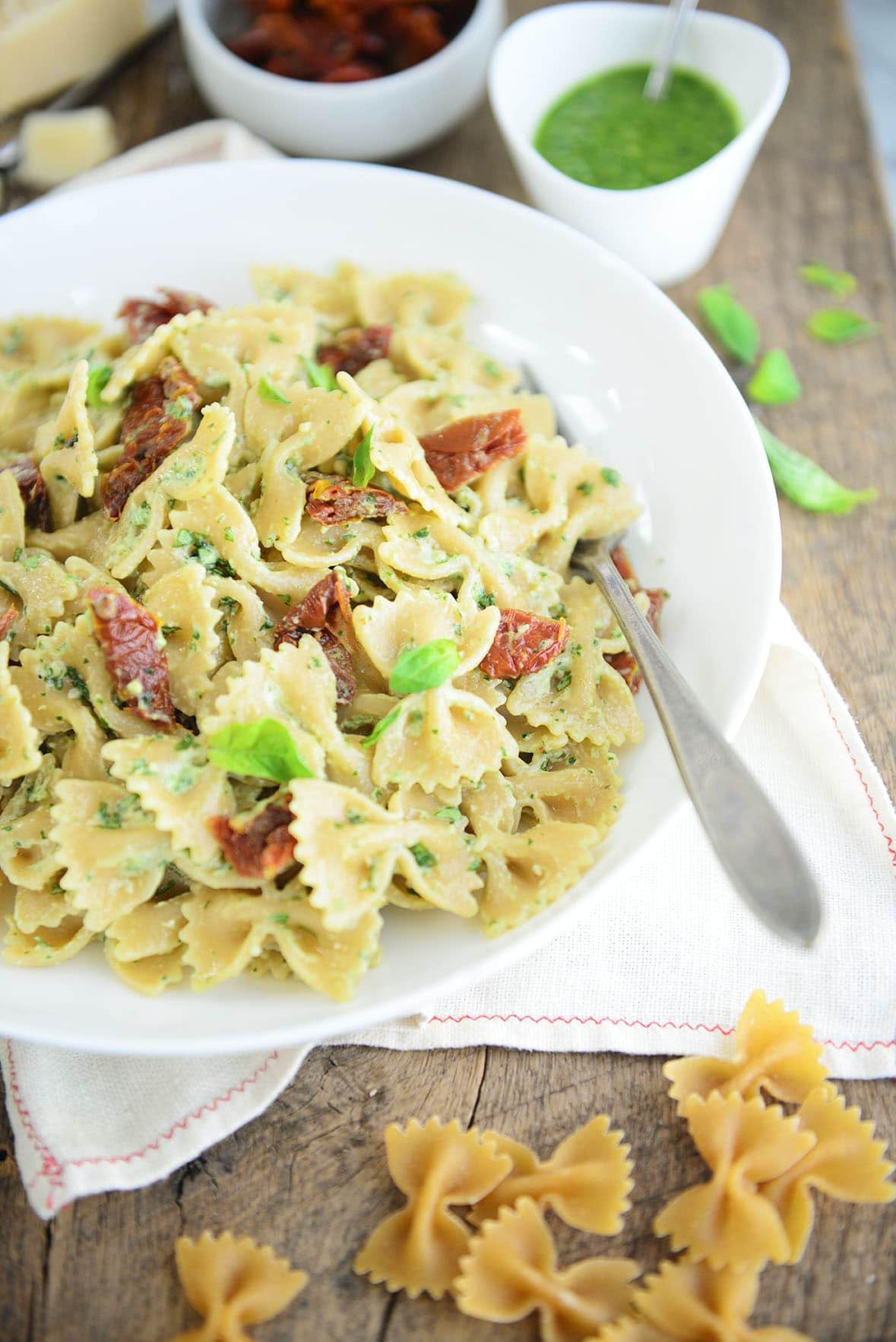 Farfalle pasta with a creamy pesto sauce and sun-dried tomatoes