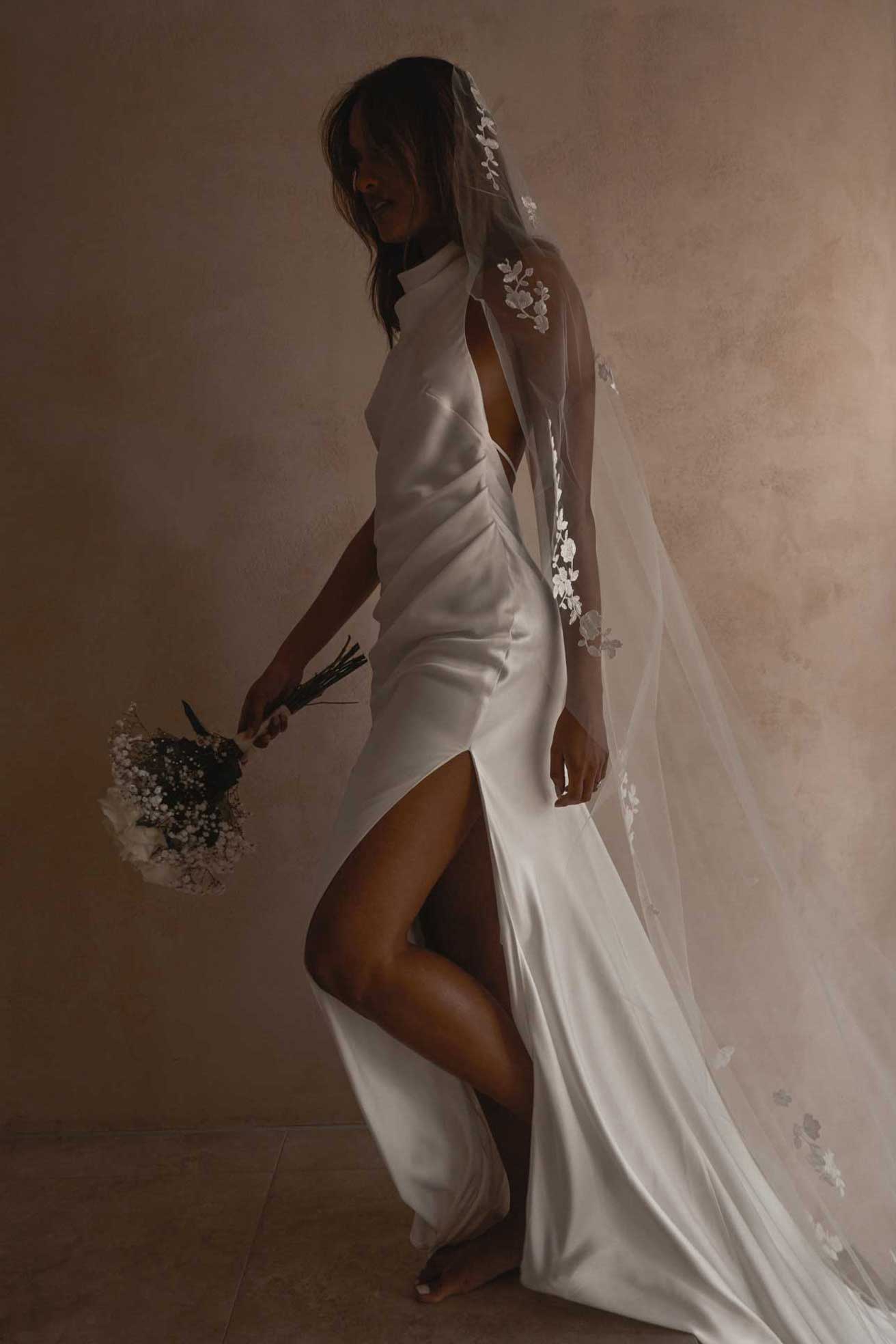 Model wearing Goldie gown and Pierlot veil