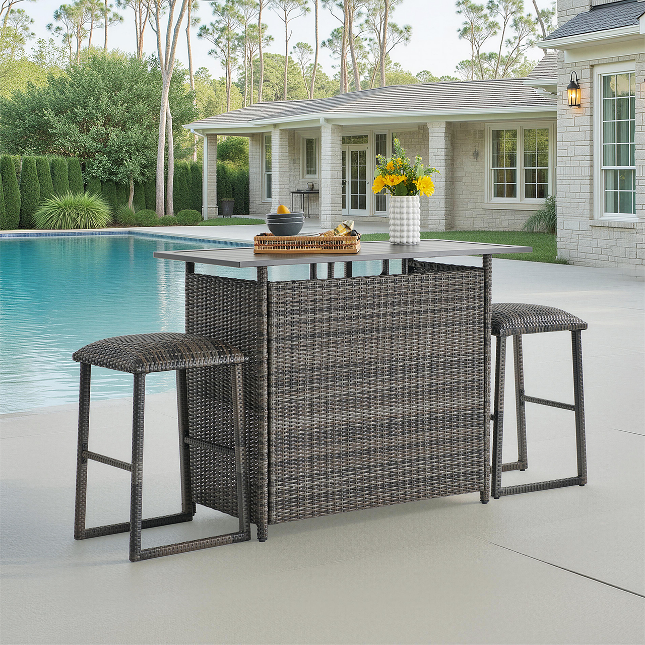 Outdoor bar table with two stools by a swimming pool.
