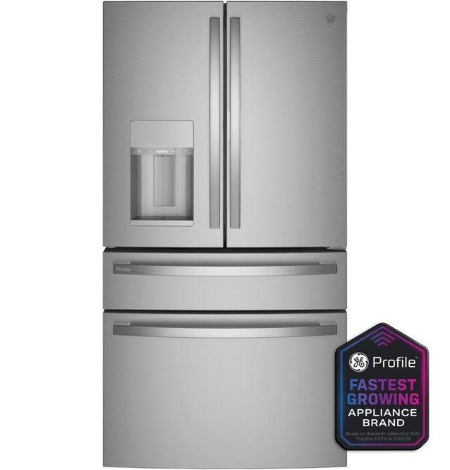 Stainless steel refrigerator with water dispenser and multiple compartments.