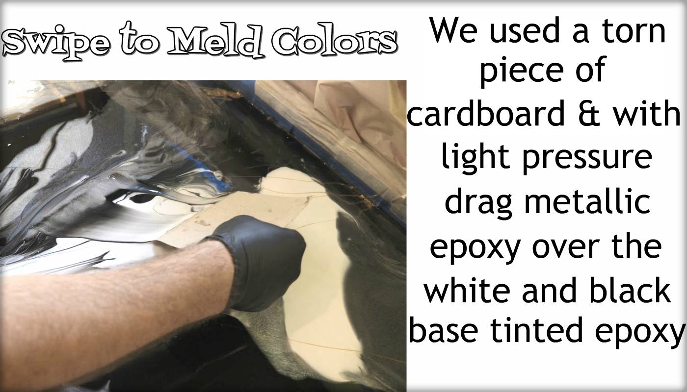 We used a torn piece of cardboard with light pressure to drag metallic epoxy over the white and black base-tinted epoxy.