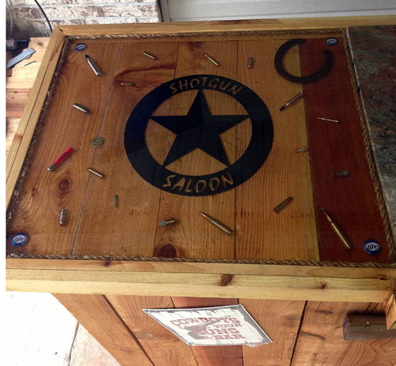 An epoxy bar top with ammunition embedded in a finish made with UltraClear Epoxy.