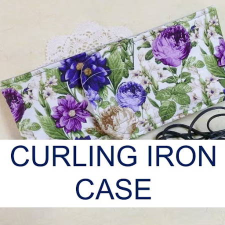 a quilted pouch with floral design to hold a curling iron