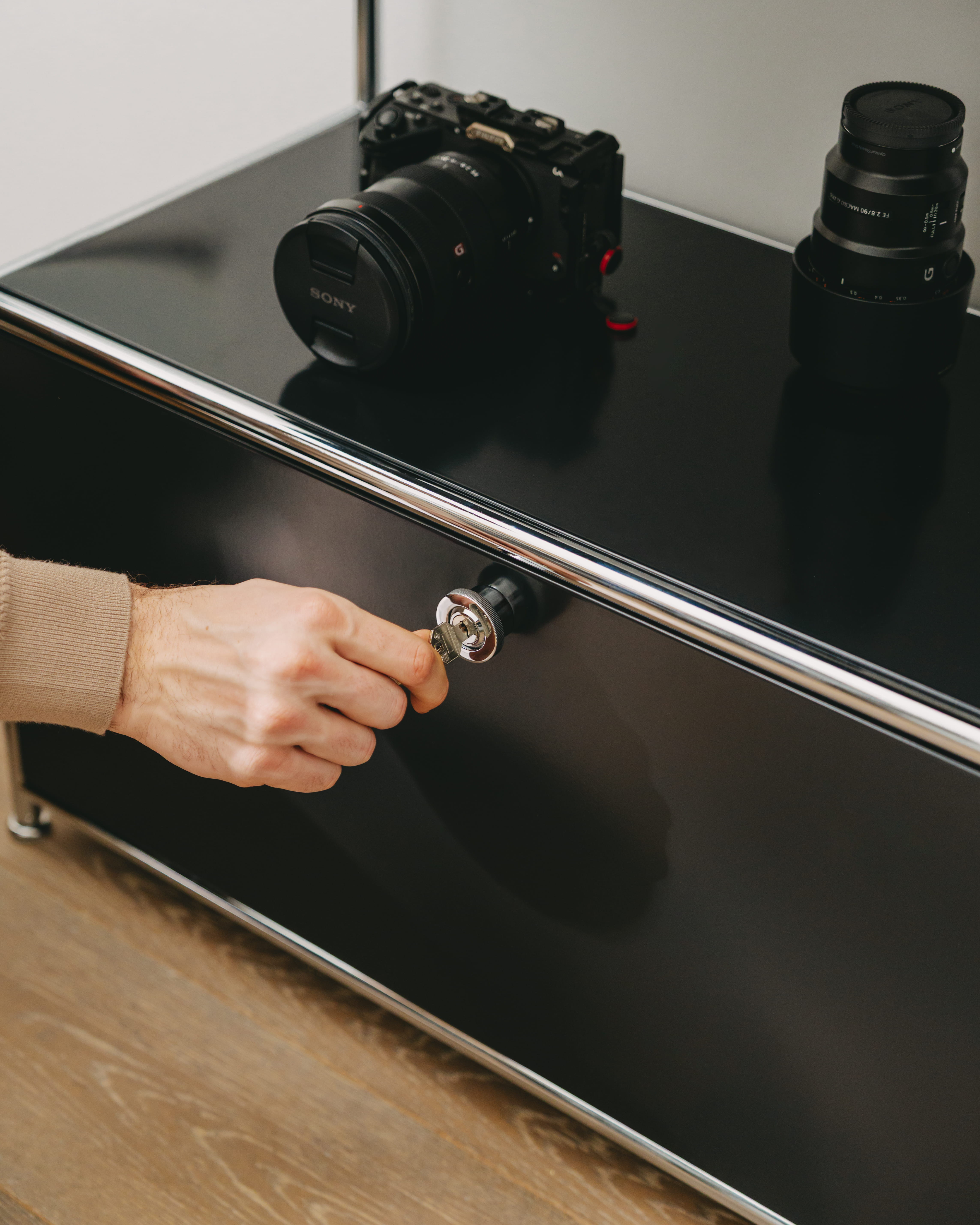 Close-up of the lock on the ofinto Cubox black chest of drawers in a living room