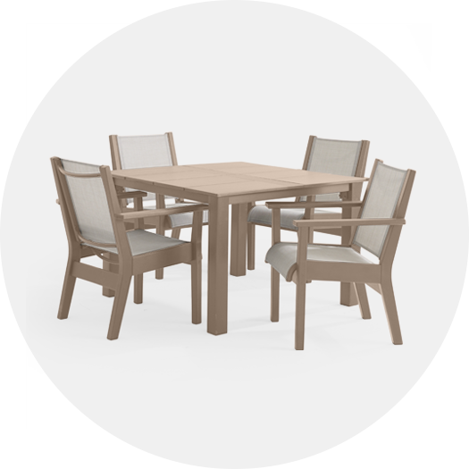 A wooden dining table with four chairs.