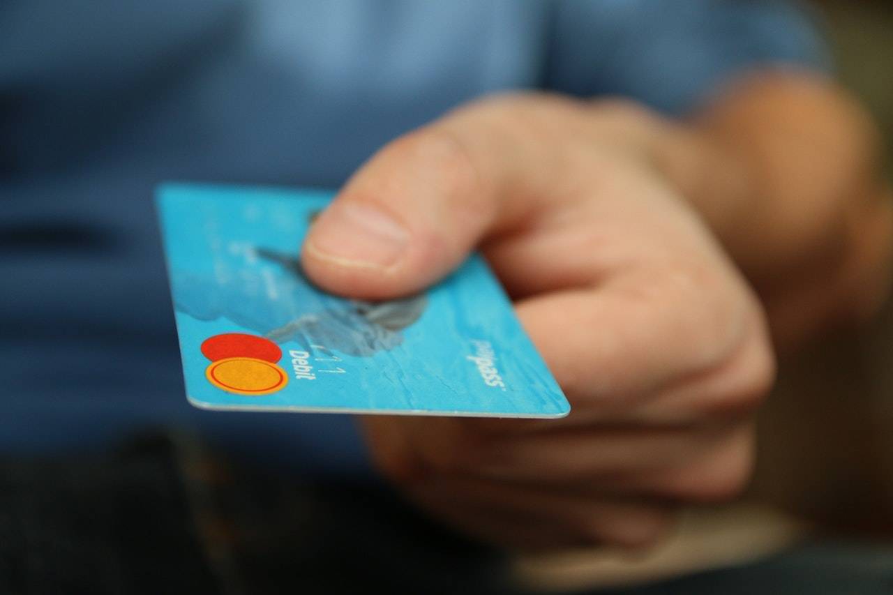 Person Holding A Bank Card