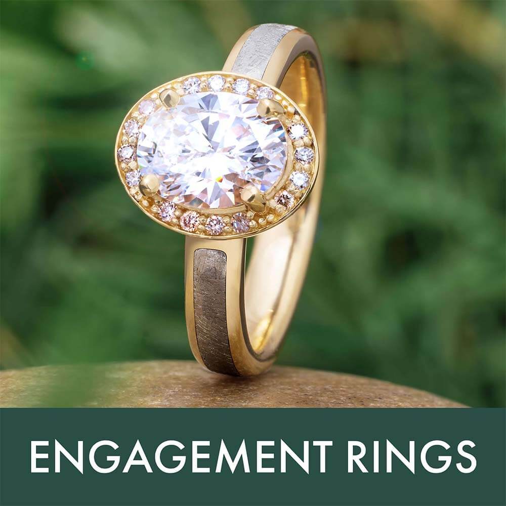 Engagement ring with a large oval diamond and gold band.
