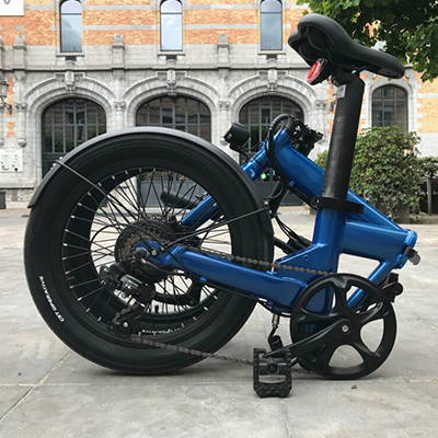 A folded full-sized folding electric bicycle.