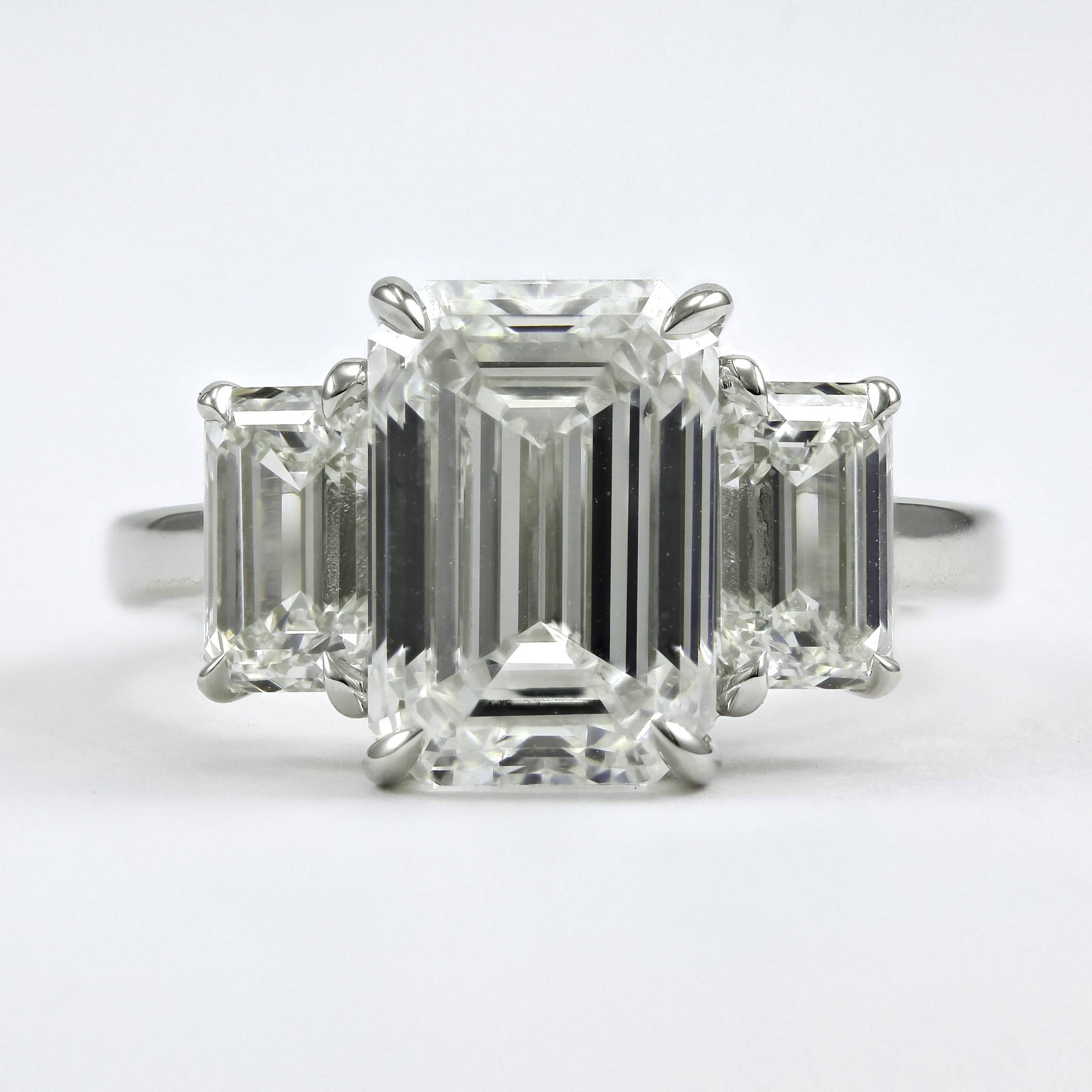 three stone emerald cut diamond ring