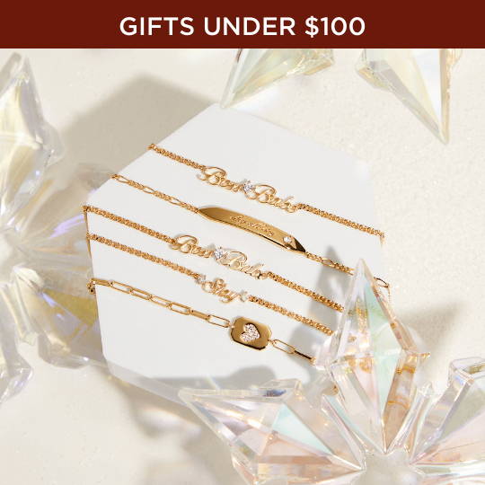 Click to Shop Gifts Under $100. Image of gold line bracelets.