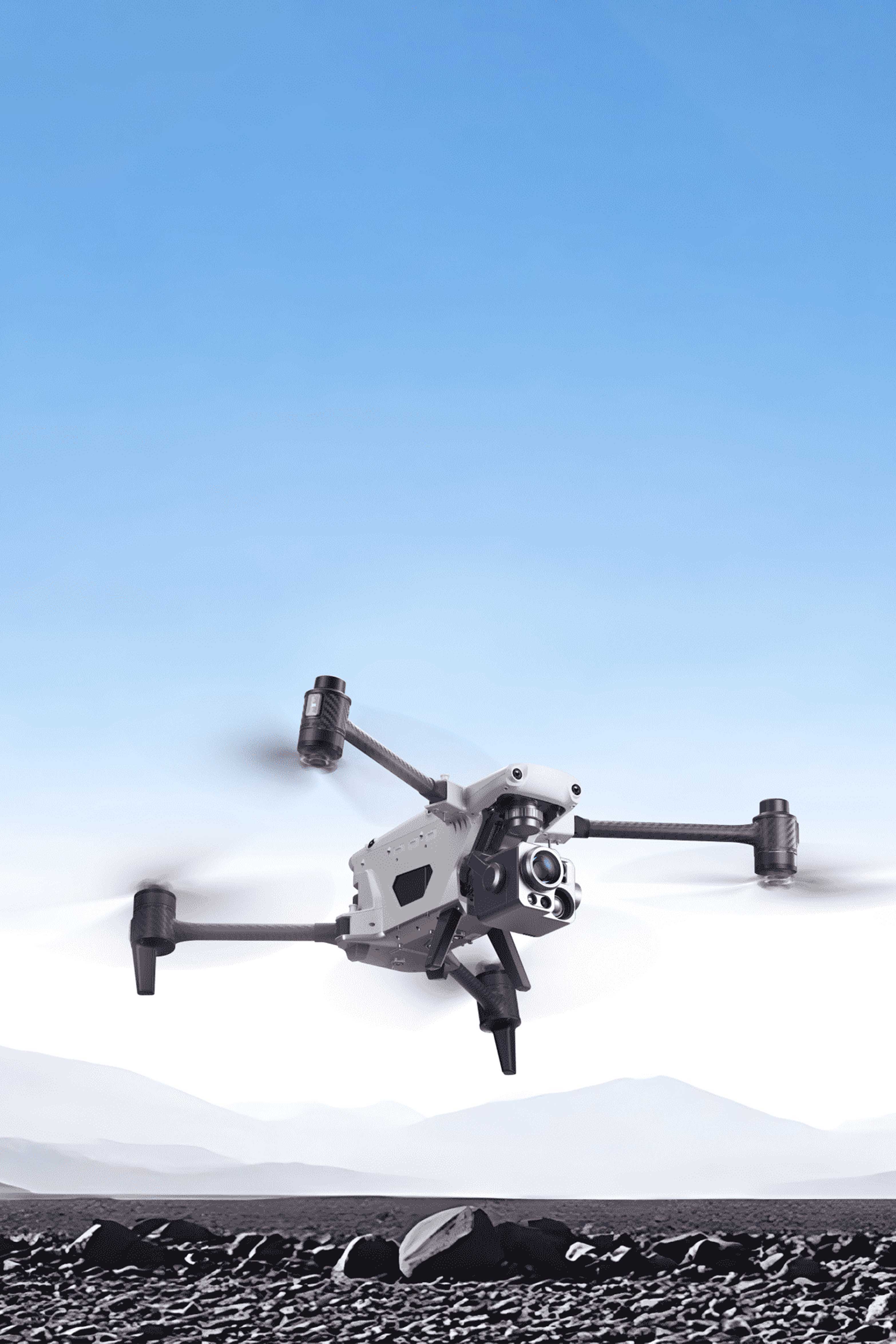 An Autel Alpha flying against a clear blue sky and mountainous backdrop.