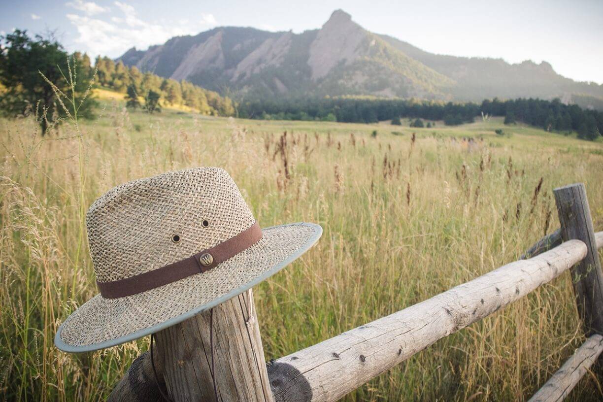 Wallaroo Hat sitting on a post in front of a mountain