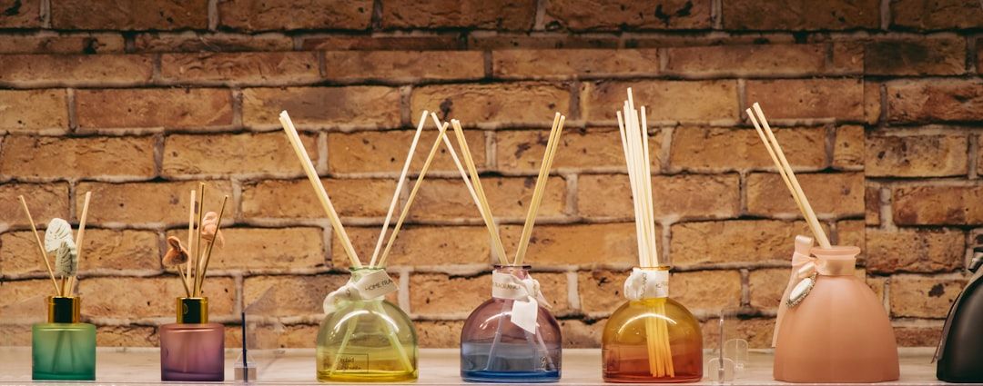 A row of bottles with sticks sticking out of them