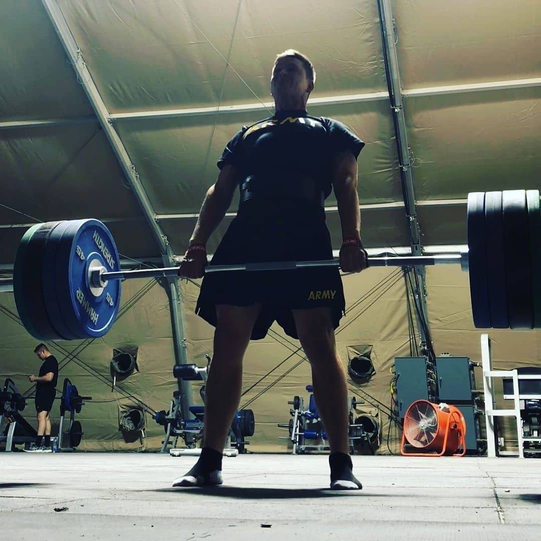 Army member deadlifting with Hammer Strength equipment on base