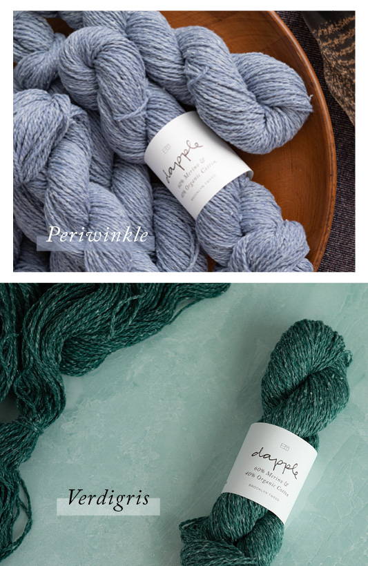 Top: A pile of Dapple skeins in color Periwinkle, one with a label, lie on a wooden plate. Bottom: A single skein of Dapple with label lying next to a wave of loose yarn both in color Verdigris.