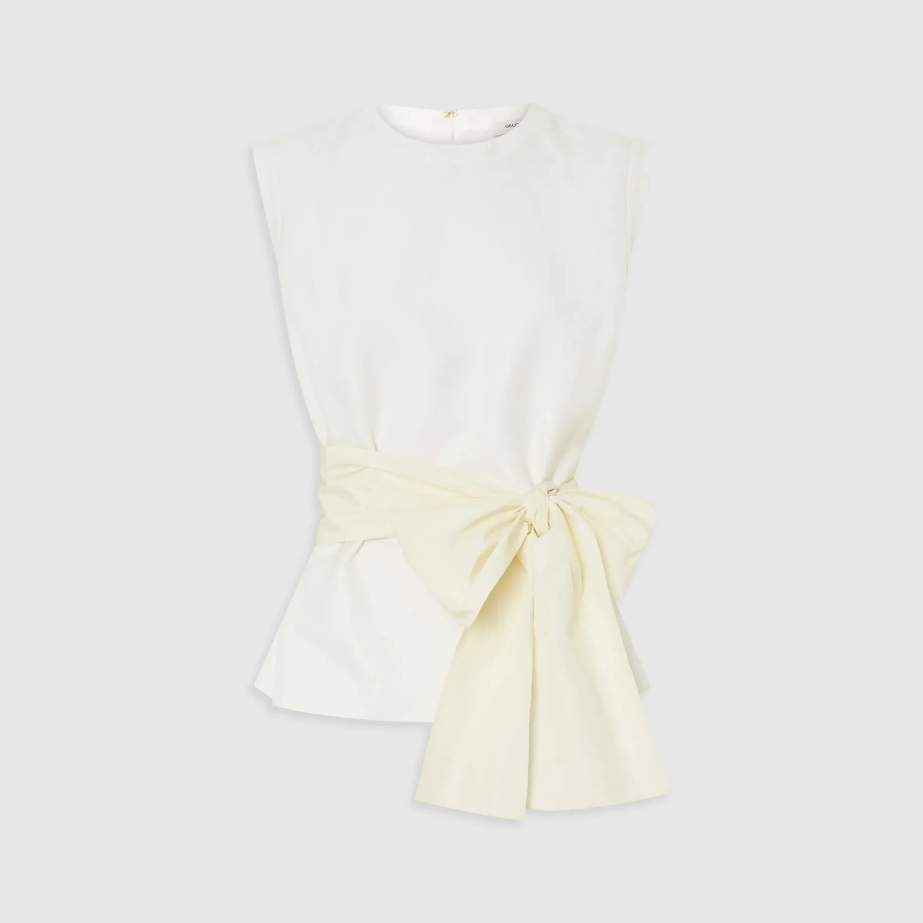 White sleeveless top with a yellow bow at the waist.