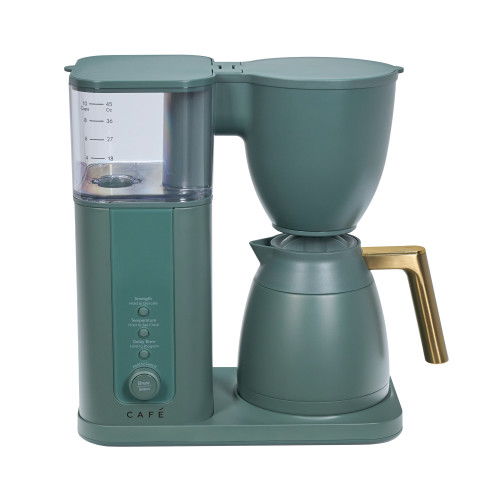 A green coffee maker with a glass water reservoir and gold handle.