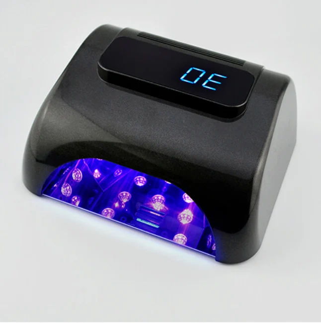 UV nail lamp with digital timer display and purple light.