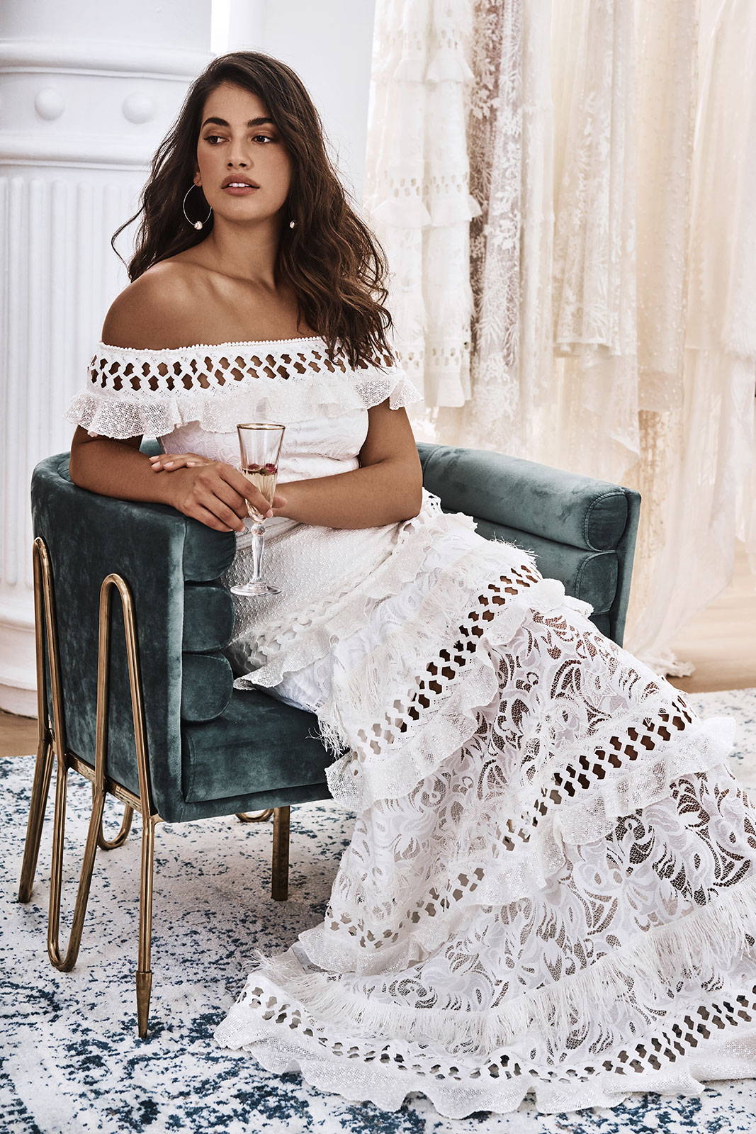 Bride in the Coco Gown enjoying a glass of champagne