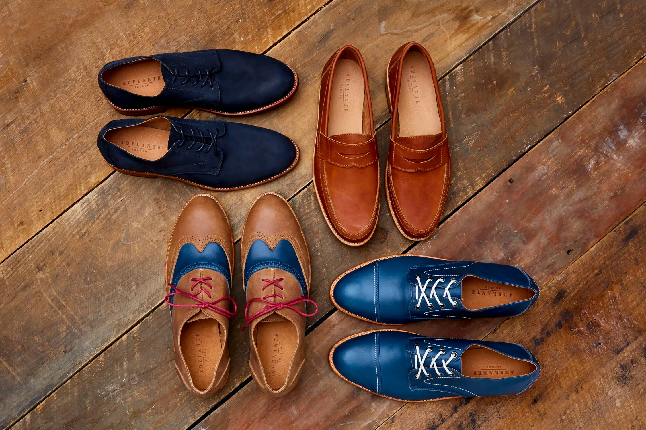 Black Romeros, Caramel Lucas, Denim Blue Marcos, and Desert & Blue Clasicos arranged on wood floor.