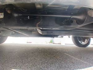 Underbody view of black air horn installation on Ford F-150