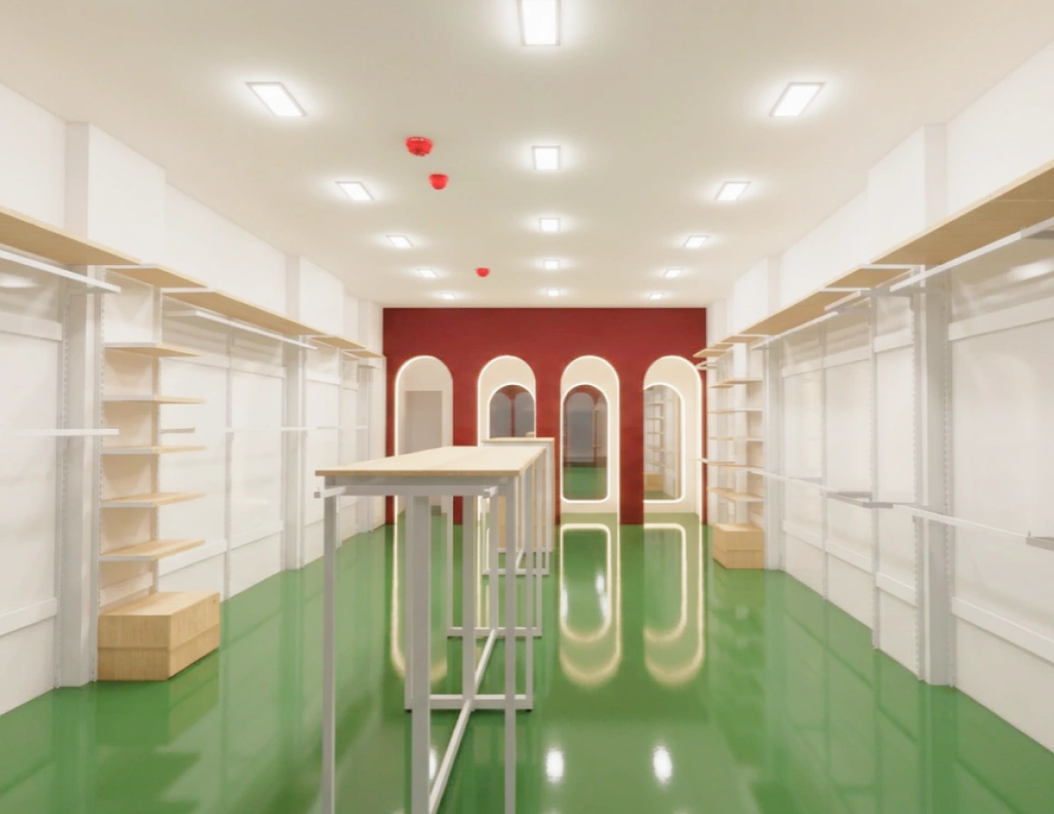 Interior of a modern, empty retail space with white walls and green flooring.
