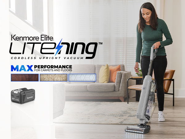 Woman using Kenmore Elite Lite™ vacuum in a modern living room.