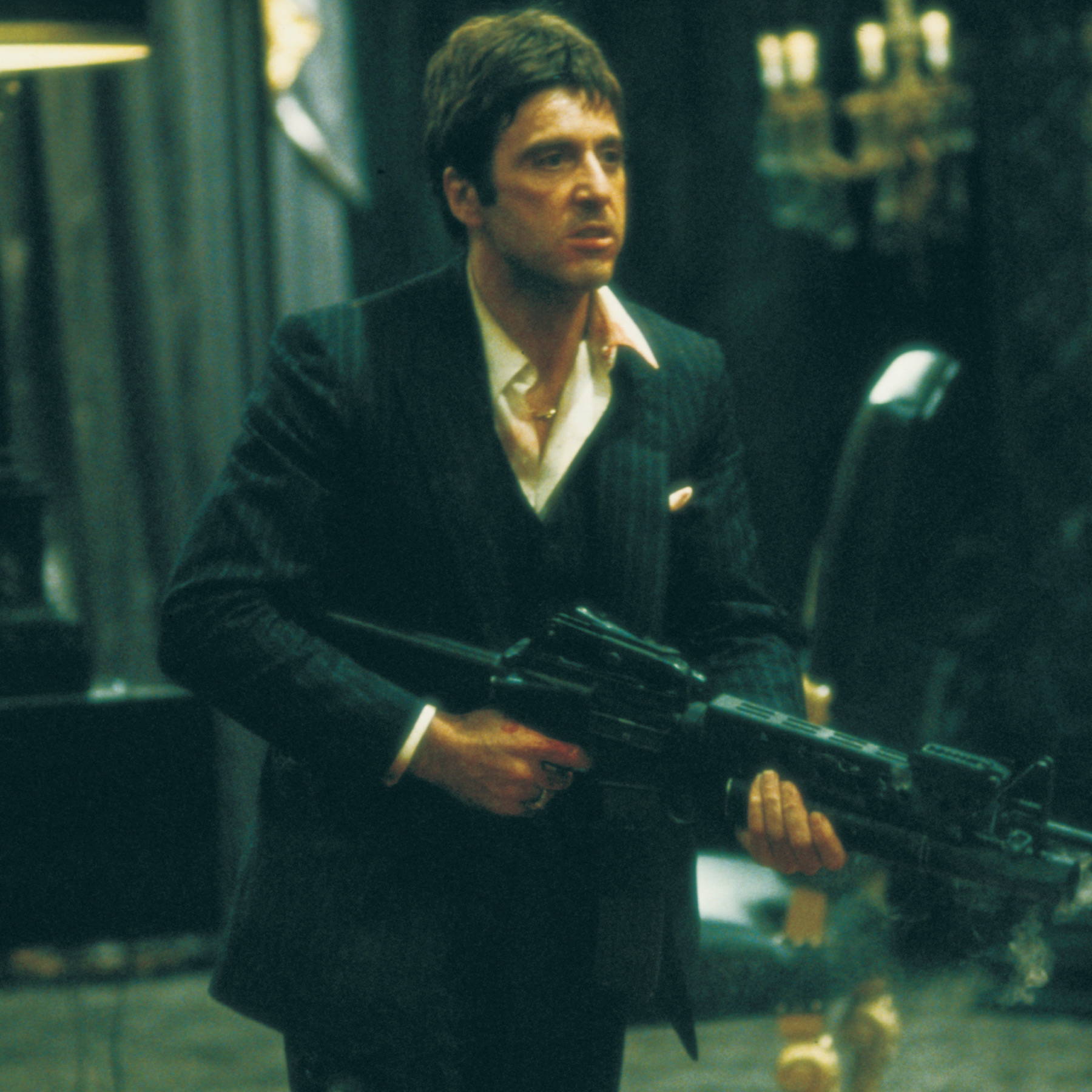 tony montana running with a gun