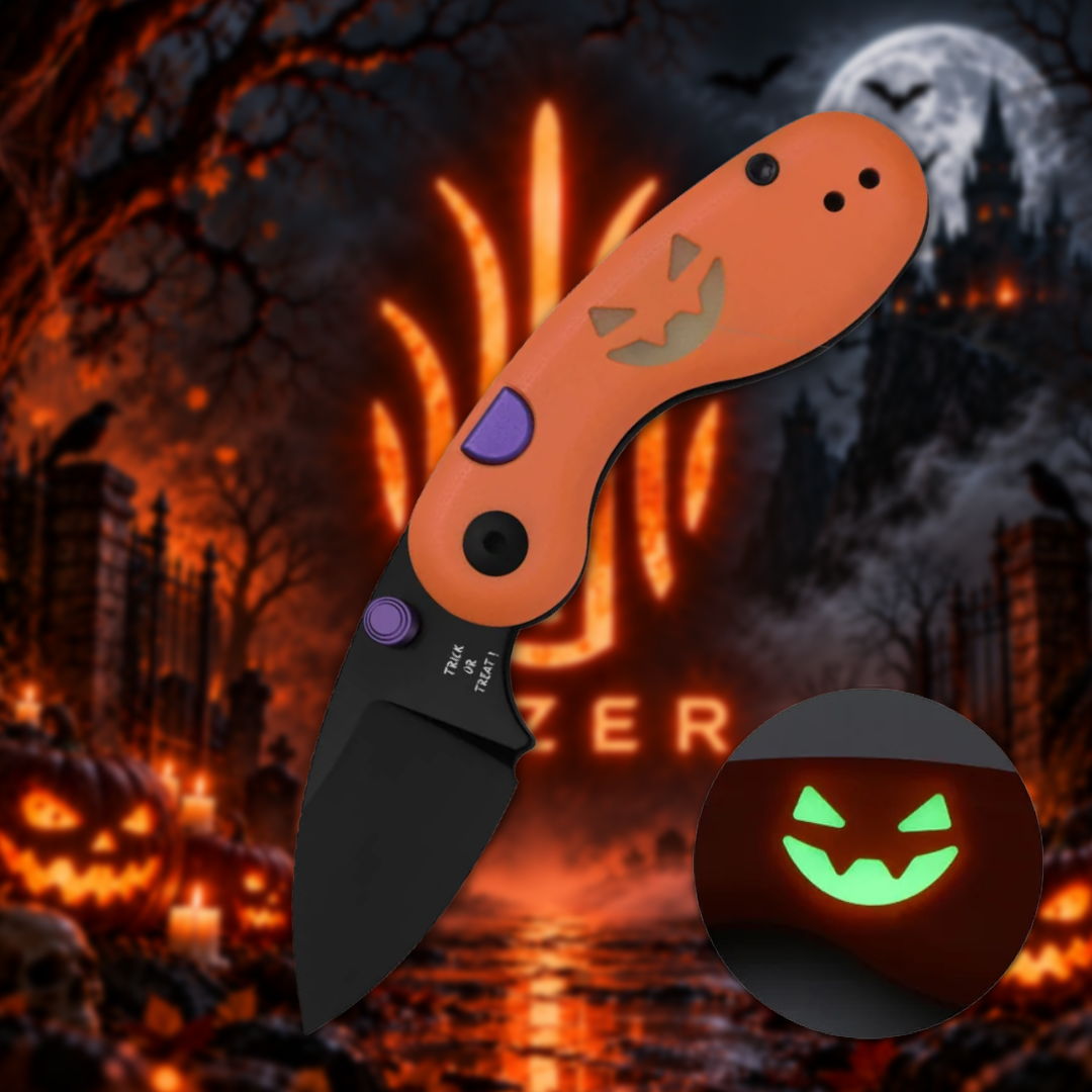 An orange folding knife with a Halloween theme background.