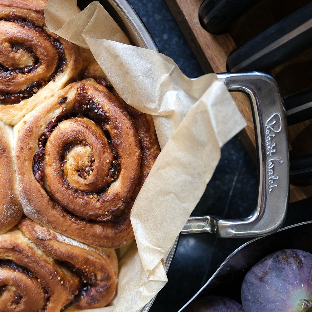 Cinnamon rolls in 316 Series Low Casserole with parchment paper.
