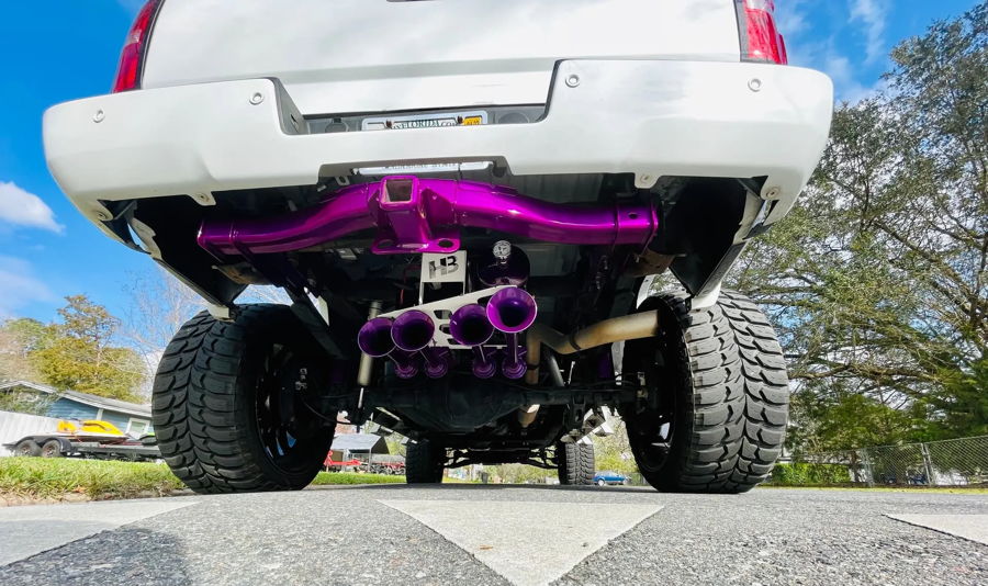 Spare tire delete tray hardware and Conductor's Special 244K kit components staged on Glenn's GMC Sierra photo 2