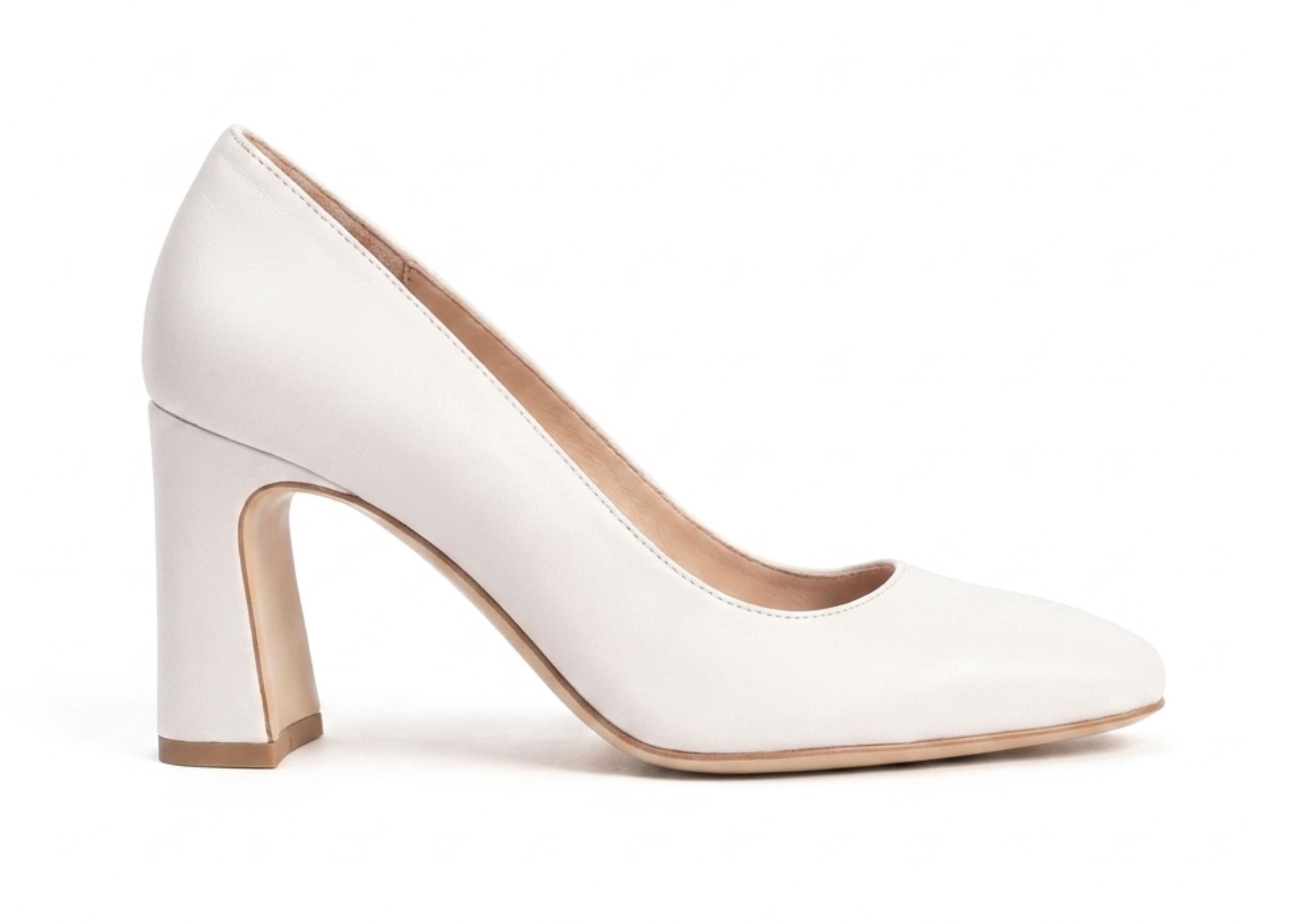 White high-heeled shoe with a chunky heel and rounded toe.