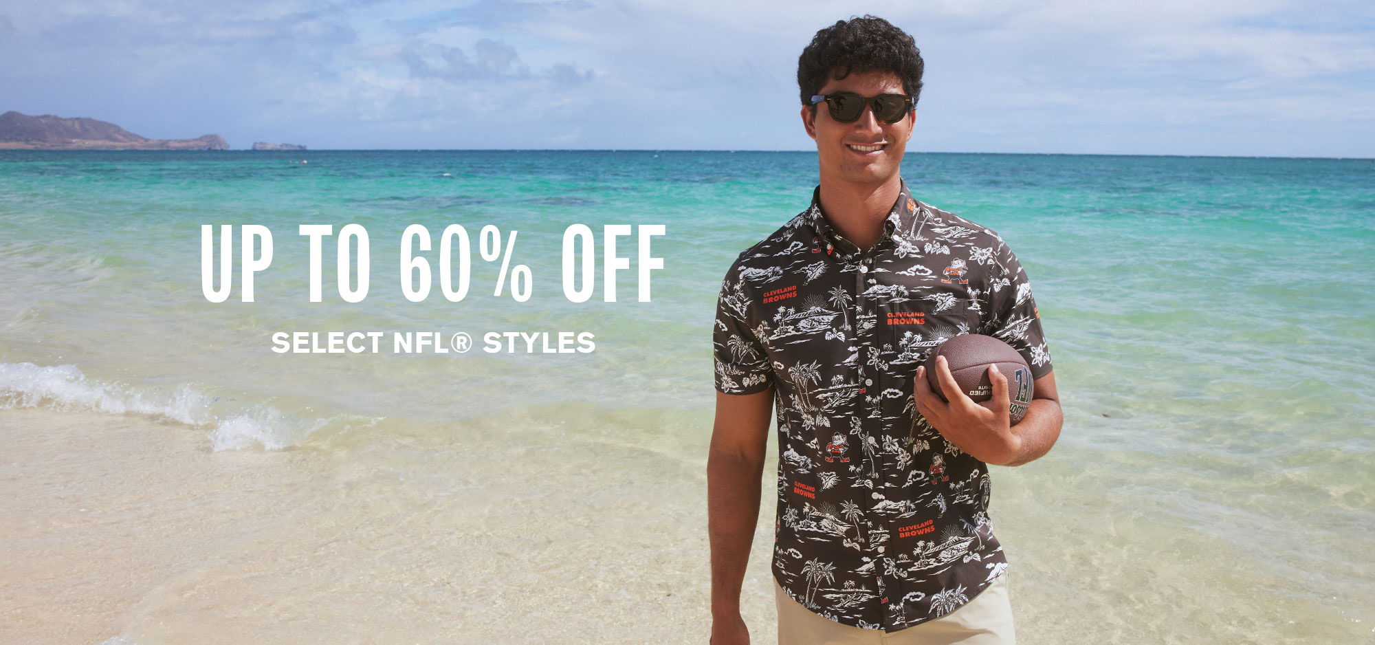 Man at the beach holding a football with promotional text for discounts.