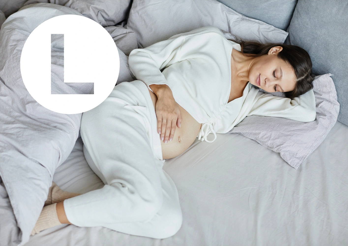 Letter L / pregnant woman in bed.
