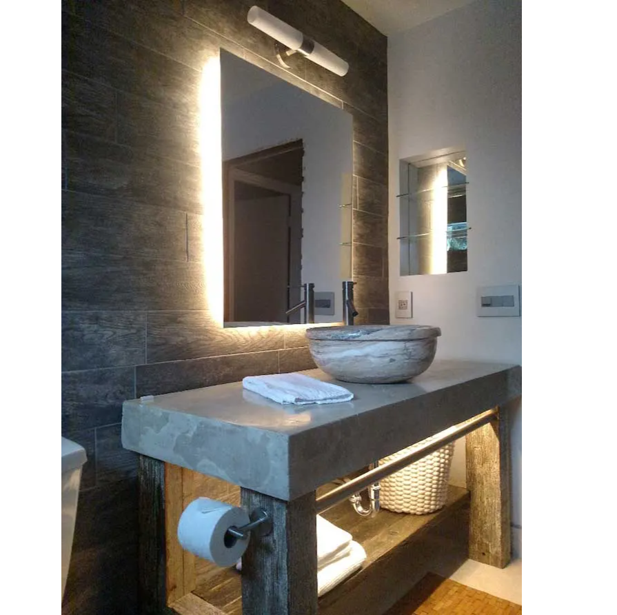 Luxury hotel bathroom design with backlit mirror using LED strip lights