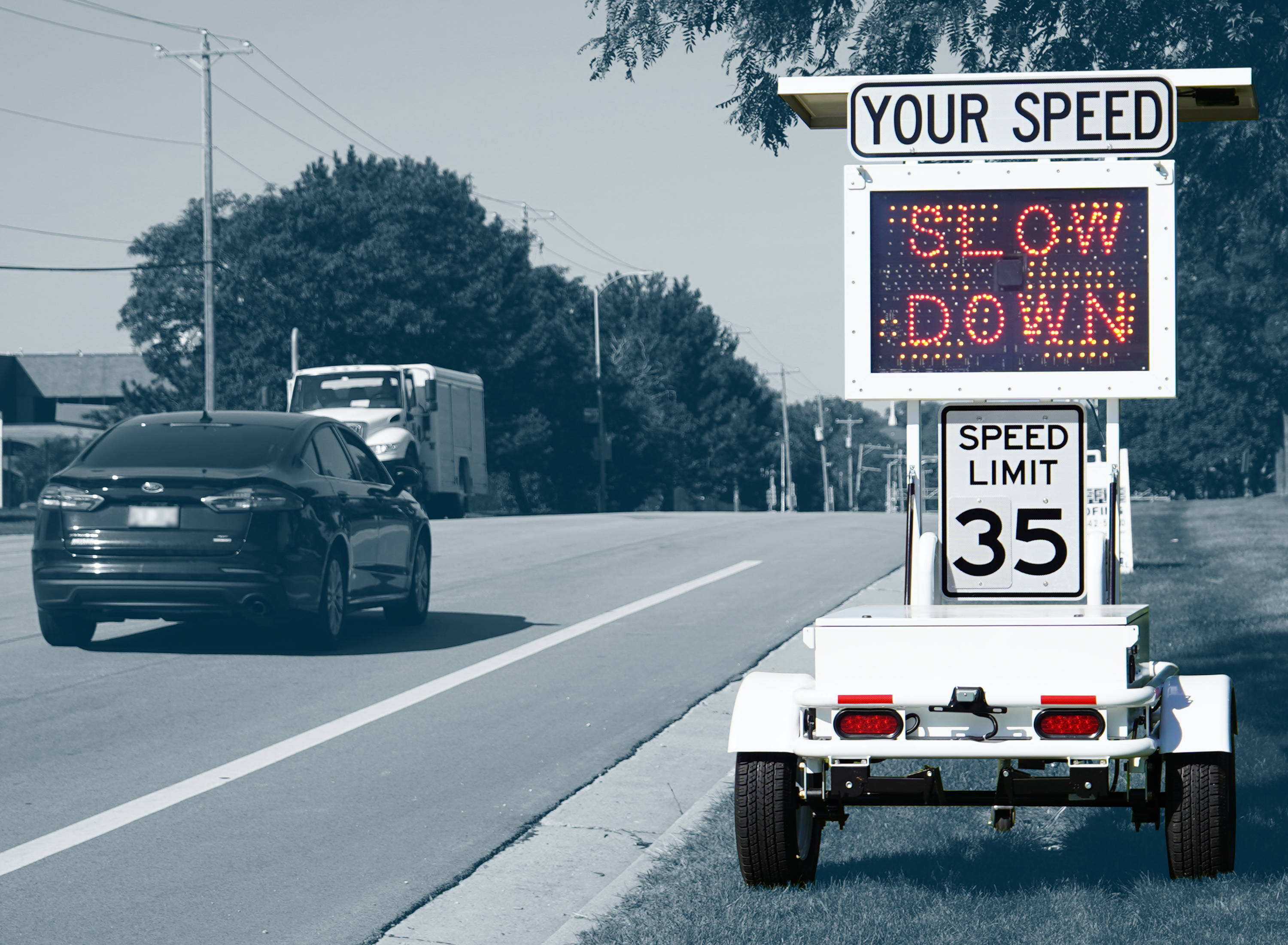 A radar speed trailer signals oncoming drivers to slow down.