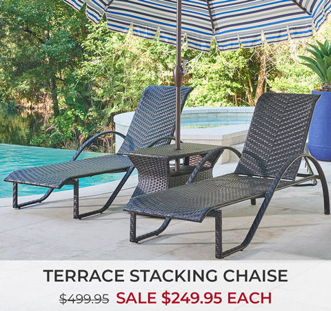 Two terrace stacking chaises beside a pool under an umbrella with sale price.