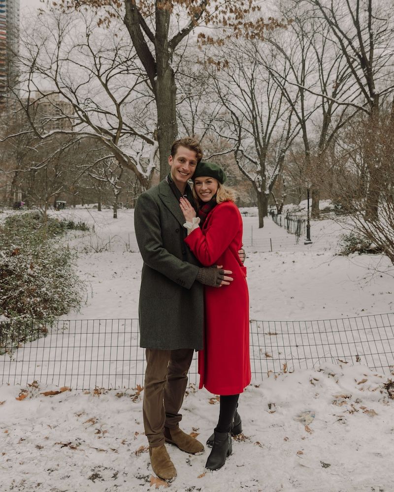 newly engaged couple embracing in wintertime, central park