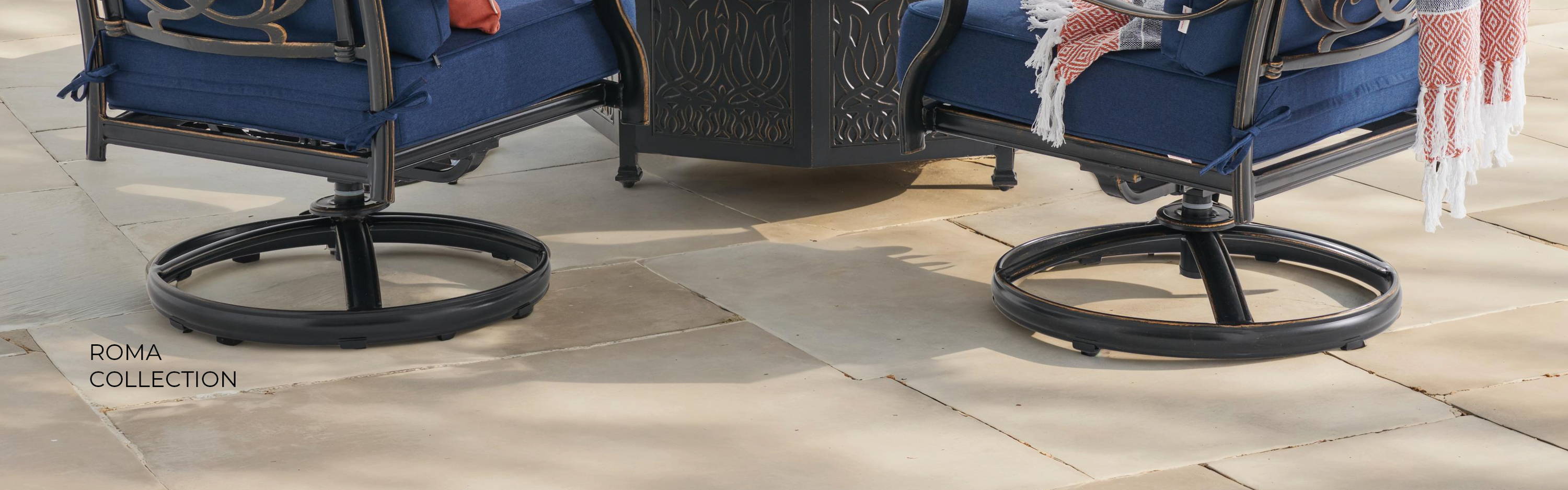 Patio seating area with four chairs and a fire pit.