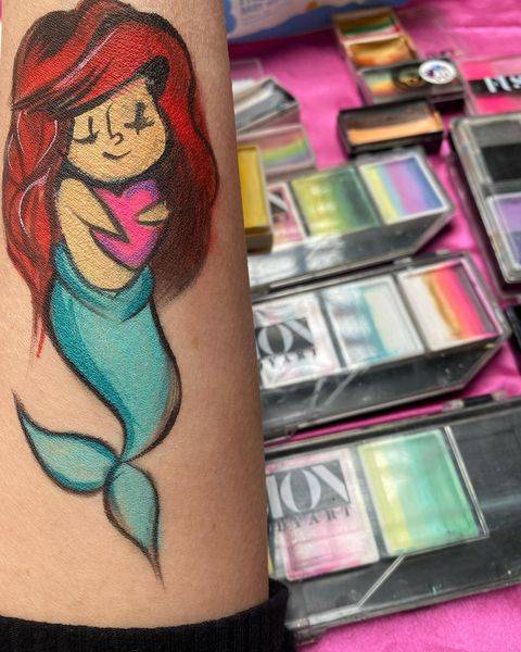 mermaid face paint desing on arm