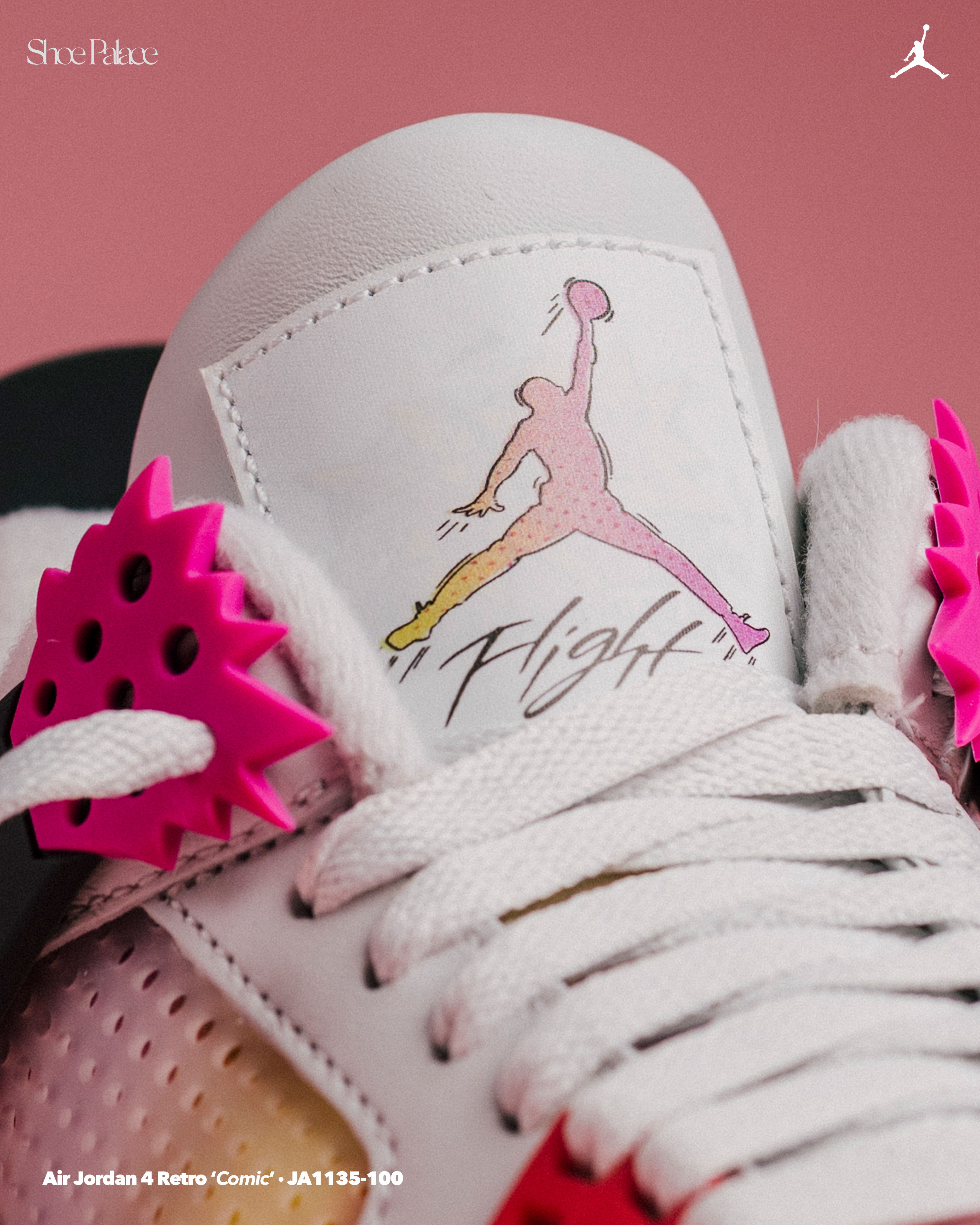 Close-up of a sneaker with a pink Jordan logo and colorful details.