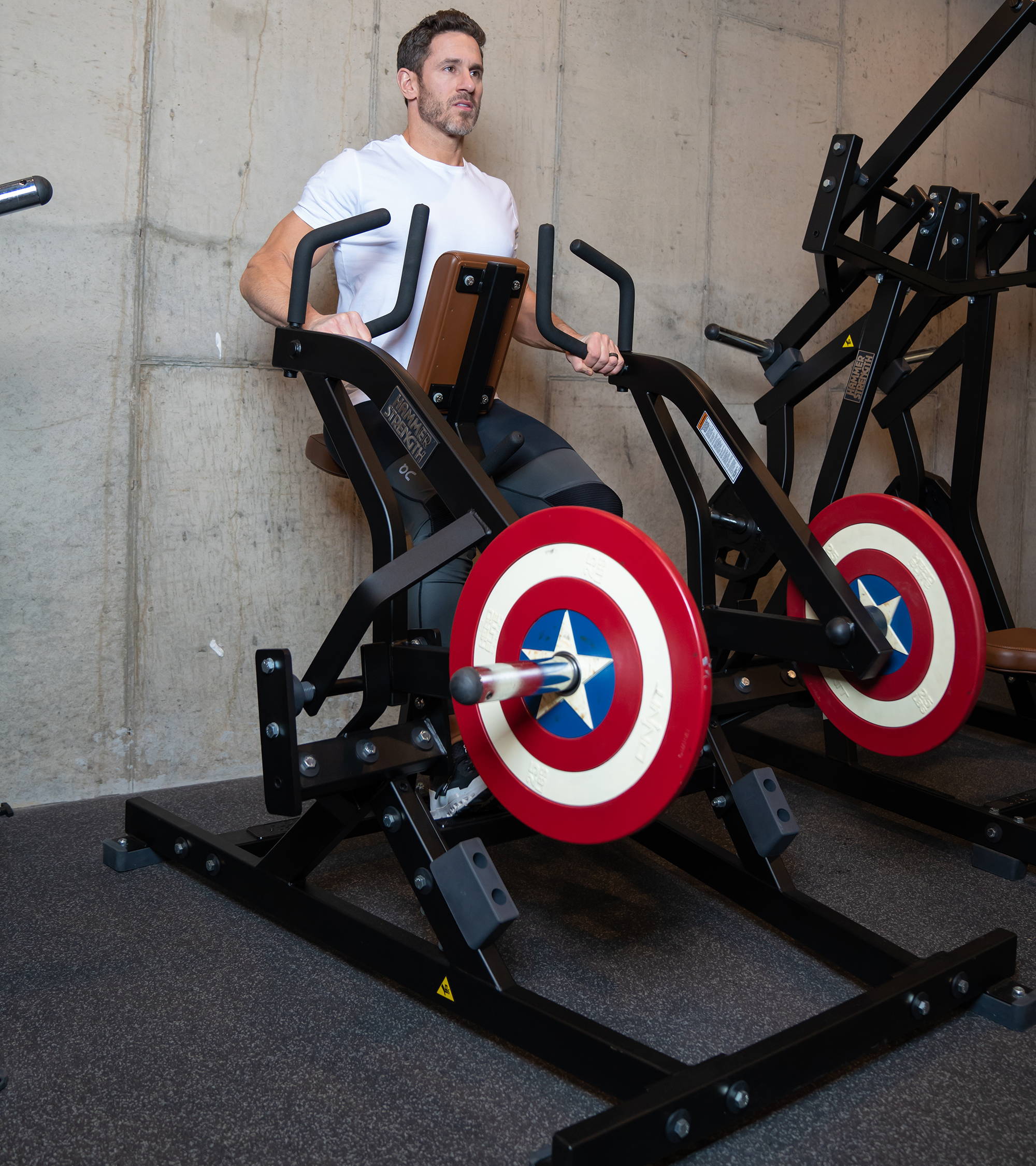 Don Saladino exercising on Hammer Strength Iso-Lateral Rowing machine in home gym