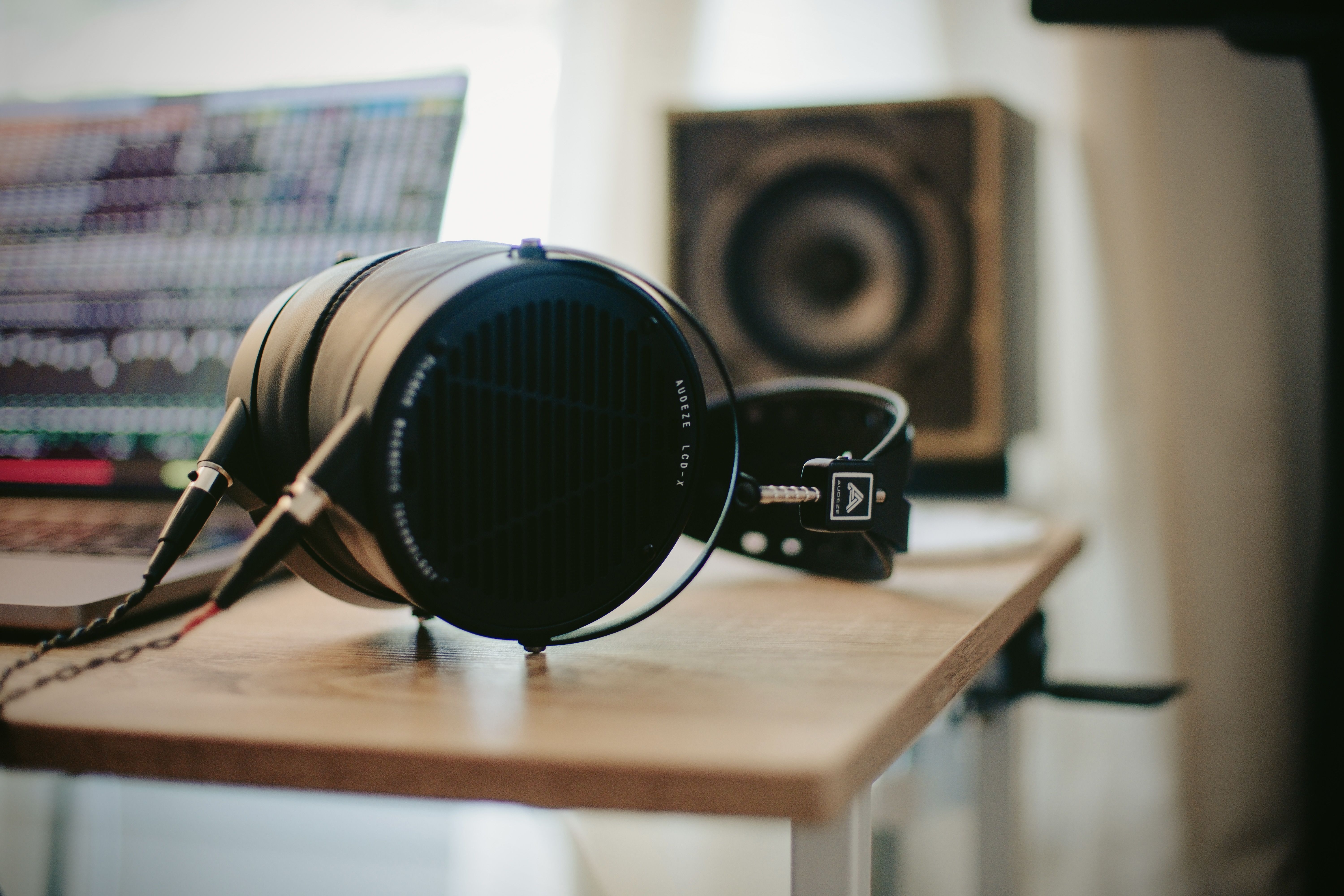 Audeze LCD-X headphones laying on the table in the studio